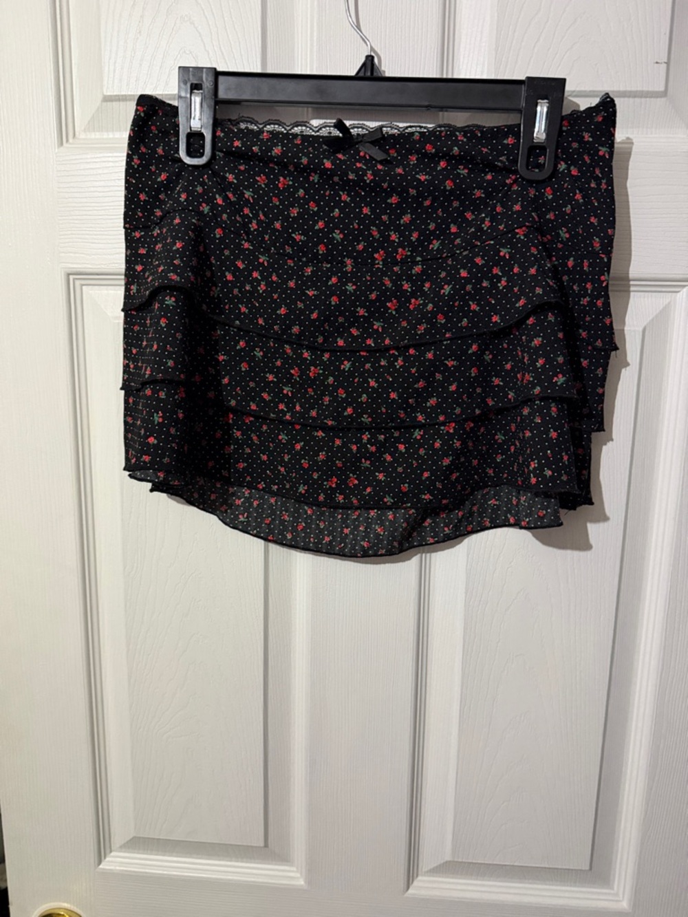 Women's Black Mini Skirt with Red Floral Print
Size M